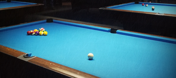 Pool Table with an 8 Ball Rack